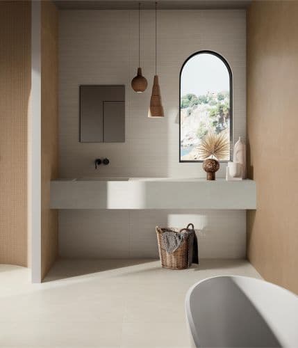 Italgraniti Terre — Ribbed bone-white walls against warm tan — texture over gloss.