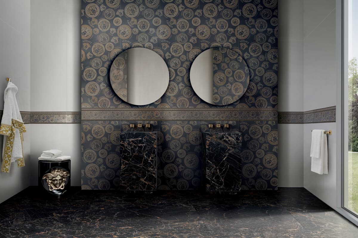 Versace Ceramics Icons — Medusa — The Medusa in relief over black and gold marble.